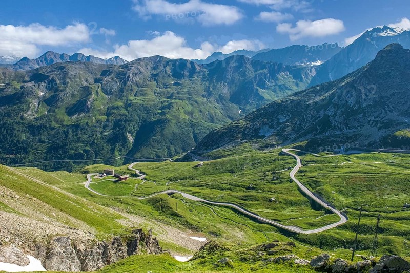 View from elevated position on last section of south ramp alpine road pass road mountain road ascent to descent from border pass Great Saint Bernard Colle del Gran San Bernardo Col du Grand Gd Saint Bernard, Valle d'Aosta region, Italy
