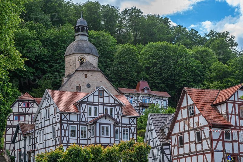 Half-timbered idyll of the old town of Bad Sooden, Allendorf, district of Bad Sooden, townscape with Protestant St. Mary's Church, tower clock, forest, hillside location, restored half-timbered houses, Werra-Meissner district, Hesse, Germany