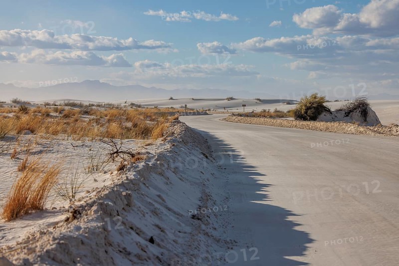 Road between sand dunes at White Sands National Park in Alamogordo, New Mexico, USA