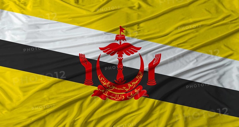 Close up of Brunei flag waving. Flag of Brunei with cloth texture