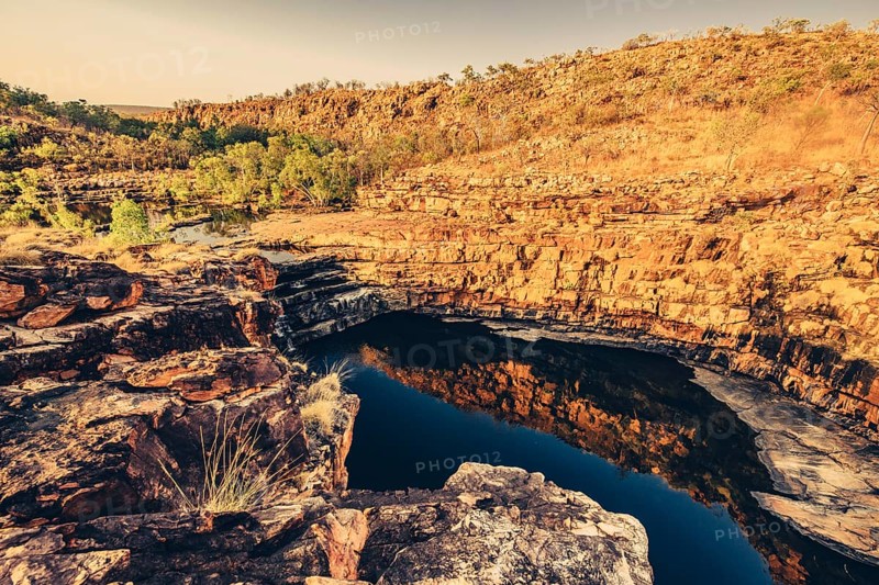 Bell Gorge waterfall, a body of water in north-west Australia in the Kimberley. Sunrise in the outback, Australia