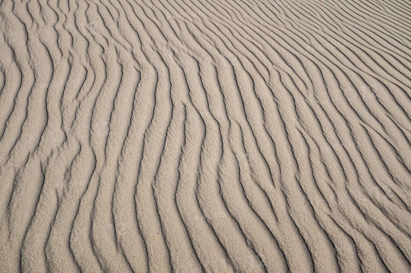 Wave-like wind-formed sand structures in close-up, Hvide Sande, North Sea, Denmark