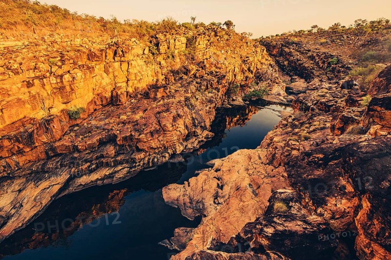 Bell Gorge waterfall, a body of water in north-west Australia in the Kimberley. Sunrise in the outback, Australia