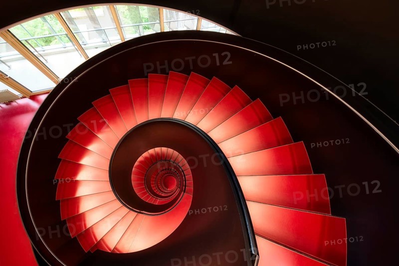 Modern red spiral staircase in an educational building, Zurich, Switzerland
