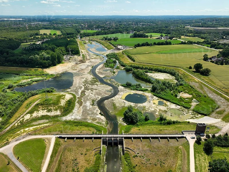 Dortmund, Castrop-Rauxel, North Rhine-Westphalia, Germany - River renaturalisation, renaturation of the Emscher, flood retention basin HRB Mengede. A new floodplain landscape is being created at the Emscher-Auen farm, expanding the area for flood protection during heavy rainfall and for biodiversity. The previously straightened Emscher is being given curves again and can meander through its new floodplain. Following the construction of a parallel sewer, the Emscher has been completely free of sewage since 2022. The river was previously an open, above-ground combined sewer with rainwater and wastewater