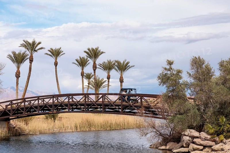 Golf cart crossing a golf cart bridge over an inlet of the Las Vegas Wash at Lake Las Vegas in Henderson, Nevada, USA