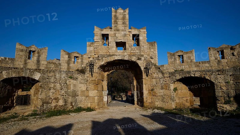 St Paul's Gate, Medieval stone castle gate under a clear blue sky, harbour area, Rhodes Town, Rhodes, Dodecanese, Greek Islands, Greece