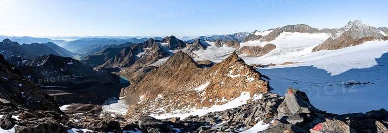 Rocky ridge on the Wilder Freiger mountain peak, behind Signal summit and Becher summit with Becherhaus, picturesque high mountain landscape, view of Übeltalferner glacier and rocky mountain peaks Königshofspitz, Sonklarspitze and Schwarzwandspitz, Stubai Alps, South Tyrol, Italy