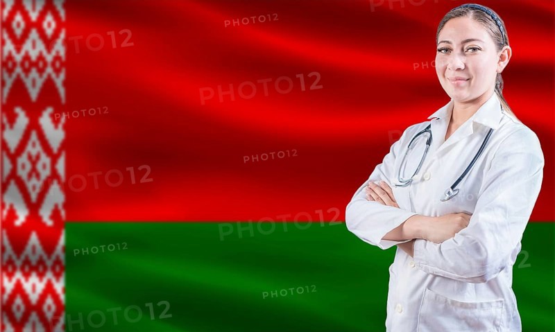Female doctor on Belarus flag. Doctor with crossed arms on Belarus flag. Belarus health and care concept