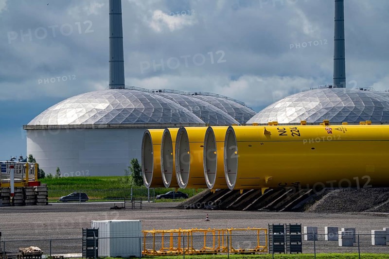 The seaport of Eemshaven, Julianahaven Basin, where the foundation structures, monopiles, for offshore wind farms are stored, which then support the actual wind turbines, the components are transported to the wind farms in the North Sea on large workboats and anchored to the seabed, where the wind turbines are then built, Eemshaven, Netherlands