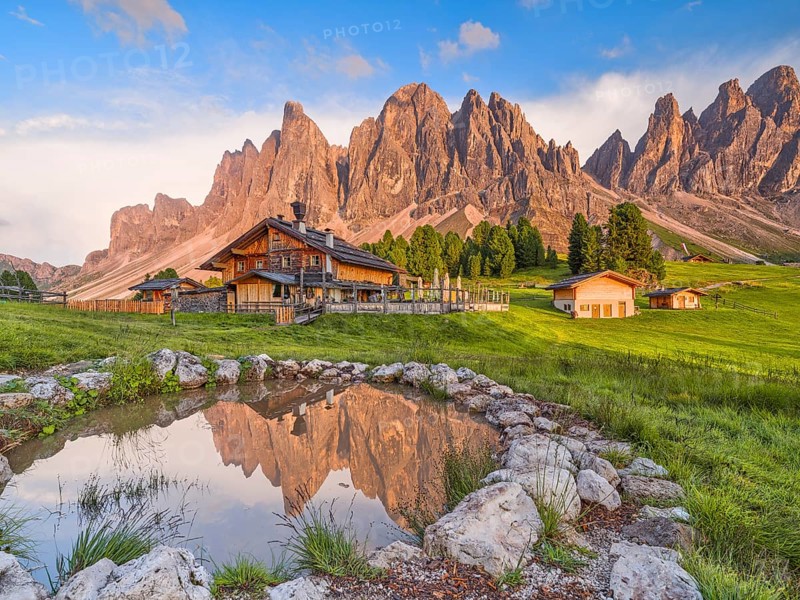 Geisleralm with Geisler group and alpenglow, reflection, Dolomites, Santa Magdalena, South Tyrol, Italy
