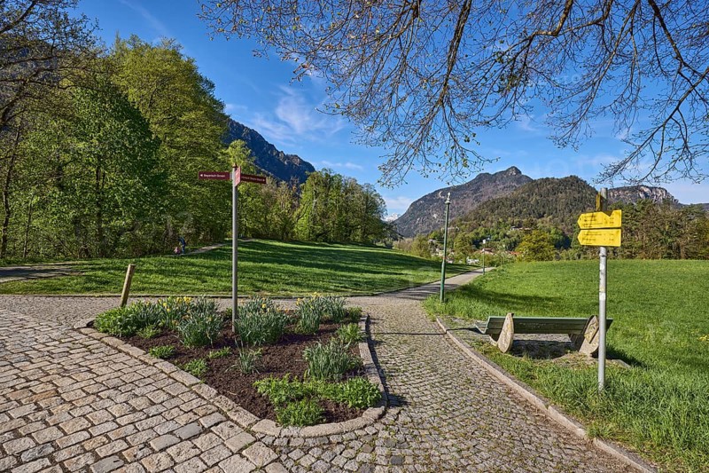 Mountain landscape, mountains, hills, forest, footpath, cobblestones, signposts, flowerbed, trees, lawn, benches, blue sky, cirrostratus clouds, Pfannhauserweg, Bad Reichenhall, Berchtesgadener Land district, Bavaria, Germany