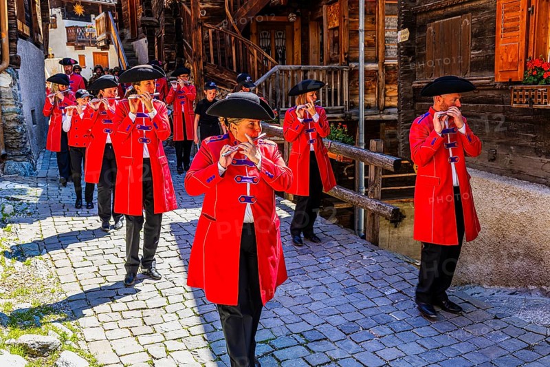 Pipers and drummers accompany the Corpus Christi procession, historic town centre, Grimentz, Val d'Anniviers, Valais Alps, Canton Valais, Switzerland