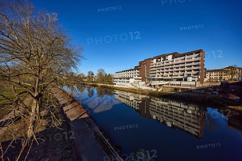 Langwied Foundation, nursing home, modern architecture, concrete architecture, Saar River, symmetrical reflections, water surface, riverbank, footpath and cycle path, lantern, blue sky, cloudless, Saarbrücken, state capital, Saarbrücken Regional Association, Saarland, Germany