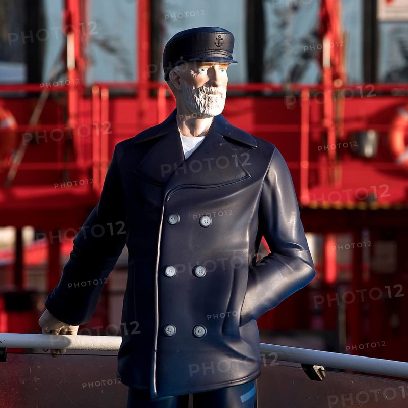 3-D figure of the captain permanently installed on the bow of the harbour ferry of line 62 in front of the ferry St. Pauli, Finkenwerder, Hamburg, Germany