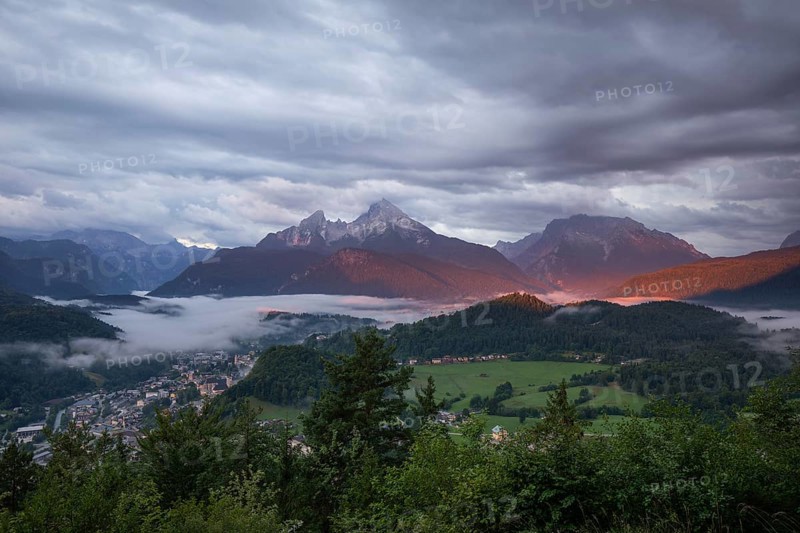 Marxenhöhe near Berchtesgaden with Watzmann view in the morning mist and alpenglow after the rain
