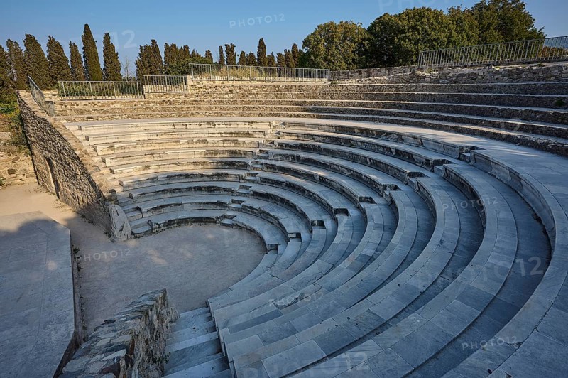 Round amphitheatre with steep steps and trees in the background, Ancient Theatre, Odeon, Kos Town, Kos, Dodecanese, Greek Islands, Greece