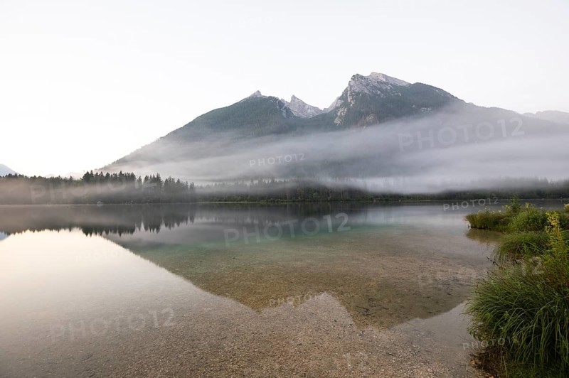 Magical sunrise with fog at Hintersee near Ramsau in Berchtesgadener Land