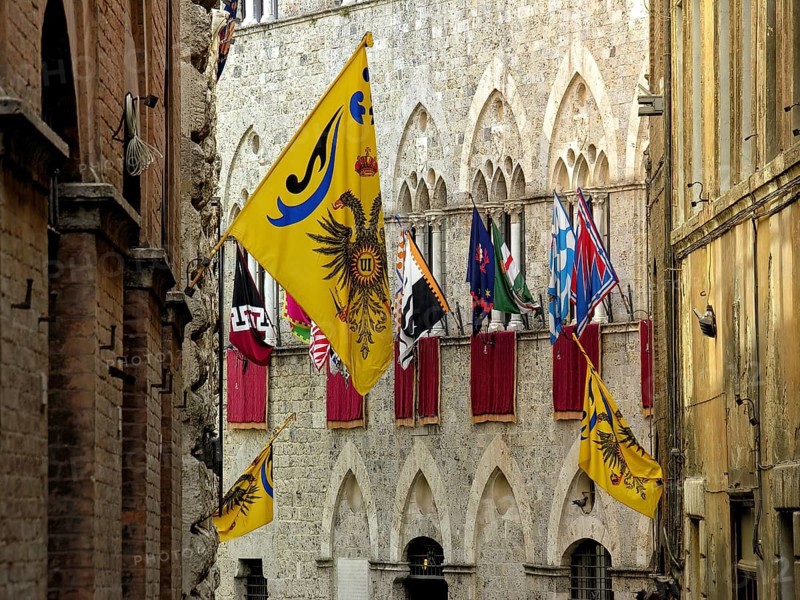 Il Palio di Siena, historic horse race, flags of the Contrade, Palazzo Chigi Saracini, historic centre, Siena, Tuscany, Italy