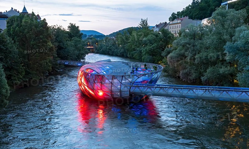 Murinsel floating island on the river Mur by night, Graz, Austria