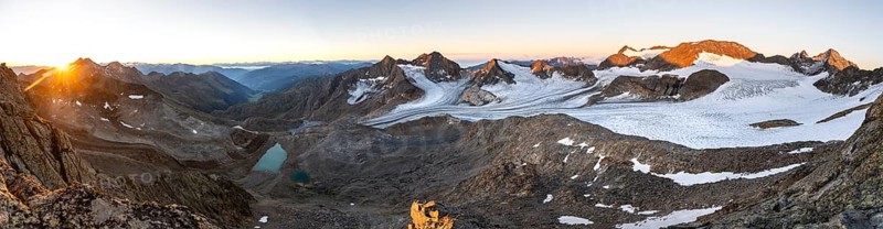 Panorama at sunrise with alpenglow, high mountain landscape, view of blue glacial lakes, mountain peaks Königshofspitz and Hofmannspitze with glacier of the Übeltalferner, Stubai Alps, South Tyrol, Italy