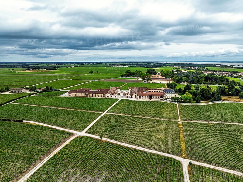 Chateau Pontet-Canet Vineyard and grape fields around Pauillac and Gironde Estuary from a drone, Bordeaux, Gironde, Nouvelle-Aquitaine, France