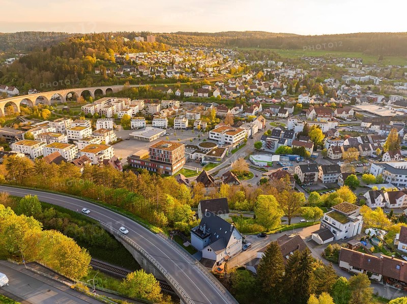 Aerial view of town with viaduct, houses and green hills, Nagold, Black Forest, Germany