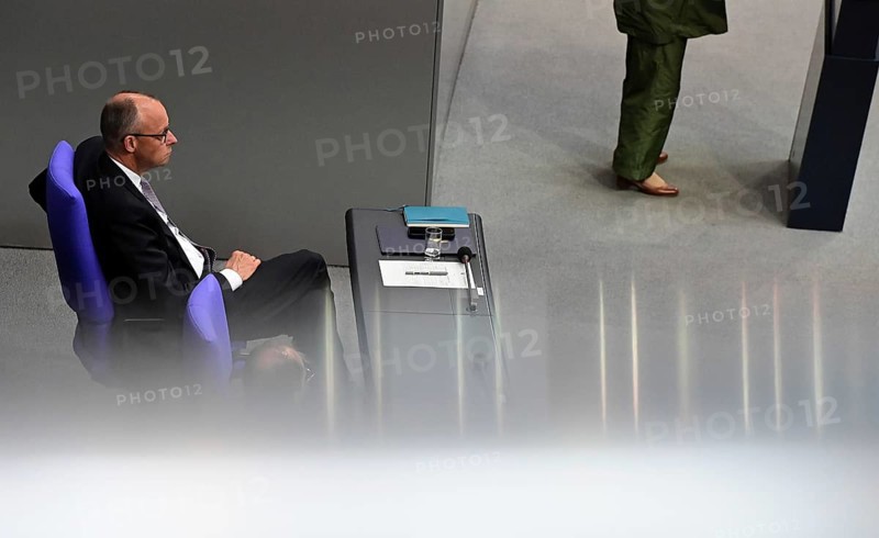 Federal Chancellor Friedrich Merz (CDU) and parts of his cabinet sit on the government bench, whilec, co-chair of the Greens parliamentary group, responds to the Federal Chancellor's government statement