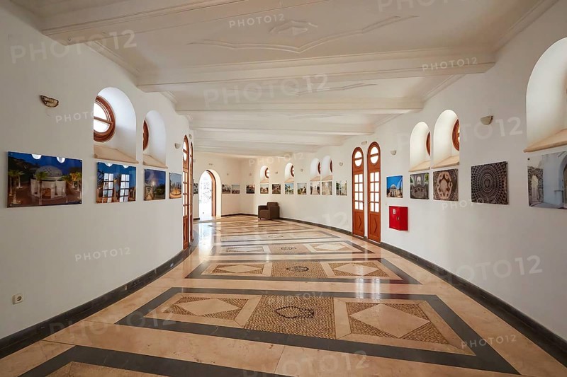 Elegant exhibition room with circular mosaic and photography on the curved wall, Kalithea, Kallithea, thermal baths, spa, Rhodes, Dodecanese, Greek Islands, Greece