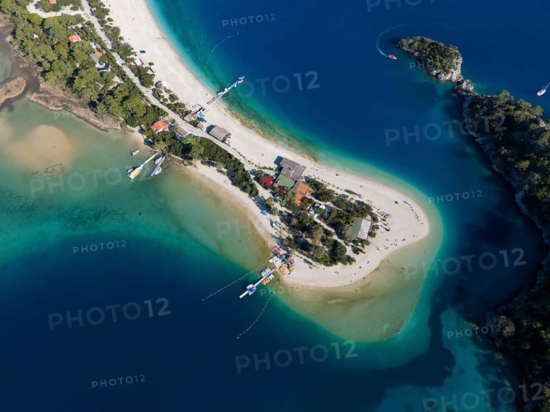 Aerial view of a small island with sandy beach and surrounding turquoise blue water and boats, Fethiye, Mugla, Mugla, Aegean Sea, Turkey