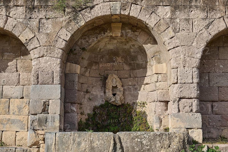 Ancient round arches with a sculpture and moss growth, arcade, lower terrace, Pan, Asklipion, Asklepieion, healing temple, temple, Hippocrates, Kos, Dodecanese, Greek Islands, Greece