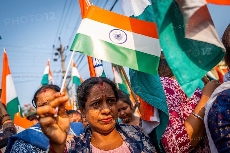 People holding Indian national flags as they take part in a rally, in soliderity with the Indian armed forces in Guwahati, India on 14 May 2025. A nationwide campaign Tiranga Yatra organized by the Bharatiya Janata Party (BJP) to honor the Indian armed forces' success in Operation Sindoor