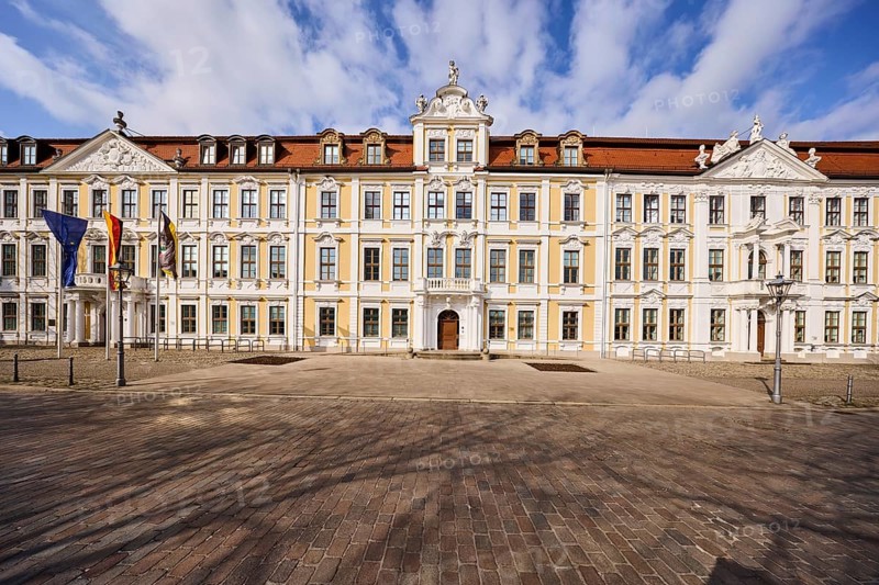 State parliament, historic houses, baroque architectural style, facade, windows, flagpoles, flags, cobblestones, blue sky, cumulus clouds, cathedral square, Magdeburg, state capital, independent city, Saxony-Anhalt, Germany