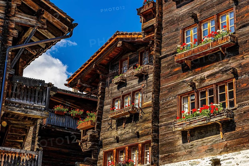 Old wooden houses in log construction, decorated with flowers, historic village centre, Grimentz, Val d'Anniviers, Valais Alps, Canton Valais, Switzerland