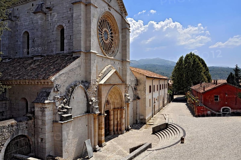 Main façade with rose window and portal, Gothic basilica of the Cistercian abbey of Fossanova Monastery, Cistercian, Burgundian architectural style, Priverno, Province of Latina, Lazio, Italy