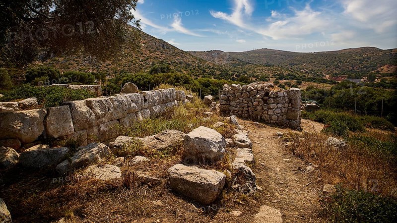 Heaven exchanged, ancient ruins in a hilly landscape with a clear blue sky and scattered clouds. Surrounded by lush vegetation, Artemis Temple, Artemis, Diana, goddess of the hunt, altar. Church, tower, near the airport in the north of the island, Leros, Dodecanese, Greek Islands, Greece