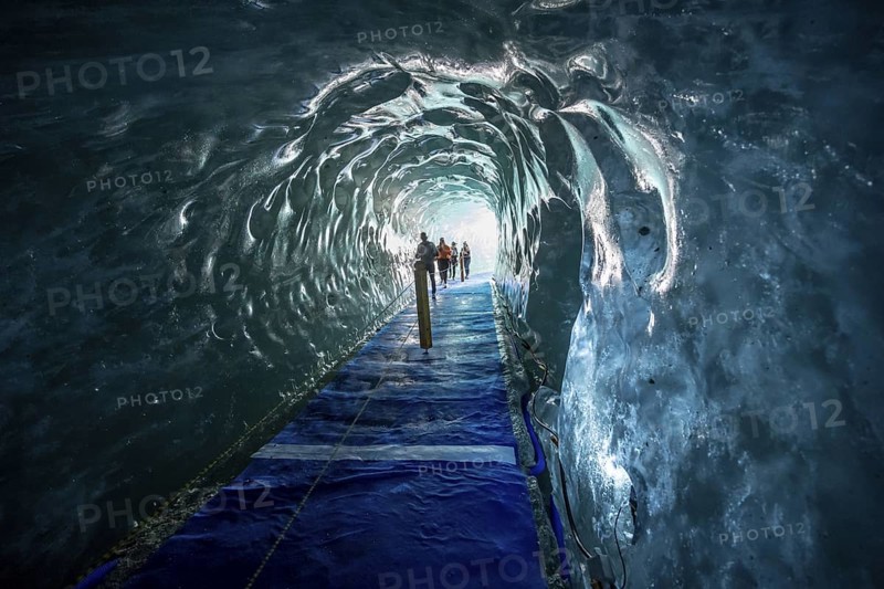 Artificial ice cave through the glacier ice, Mer de Glace, Montenvers, Chamonix, Haute-Savoie, France
