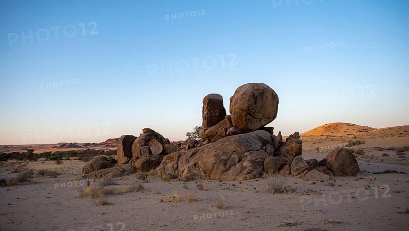 Round stacked rocks, desert landscape at sunset, Erongo, Damaraland, Namibia