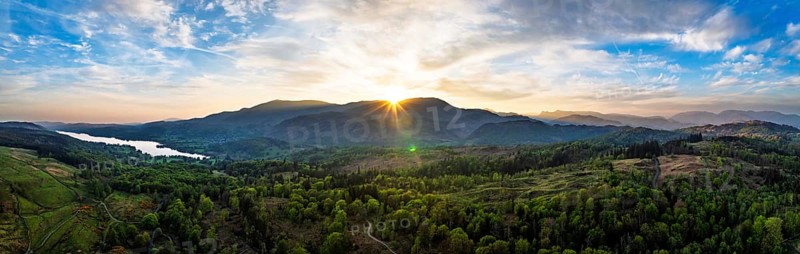 Panorama of Sunset over Mountains and Coniston Water from drone, Lake District National Park, Cumbria, England, United Kingdom