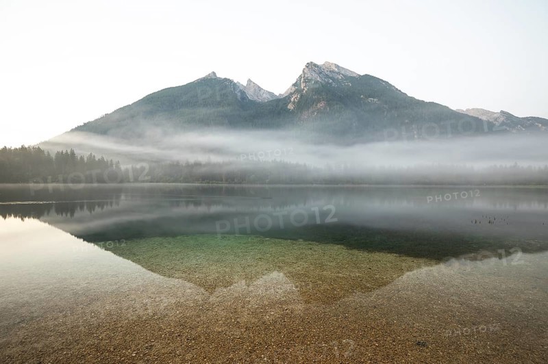 Magical sunrise with fog at Hintersee near Ramsau in Berchtesgadener Land