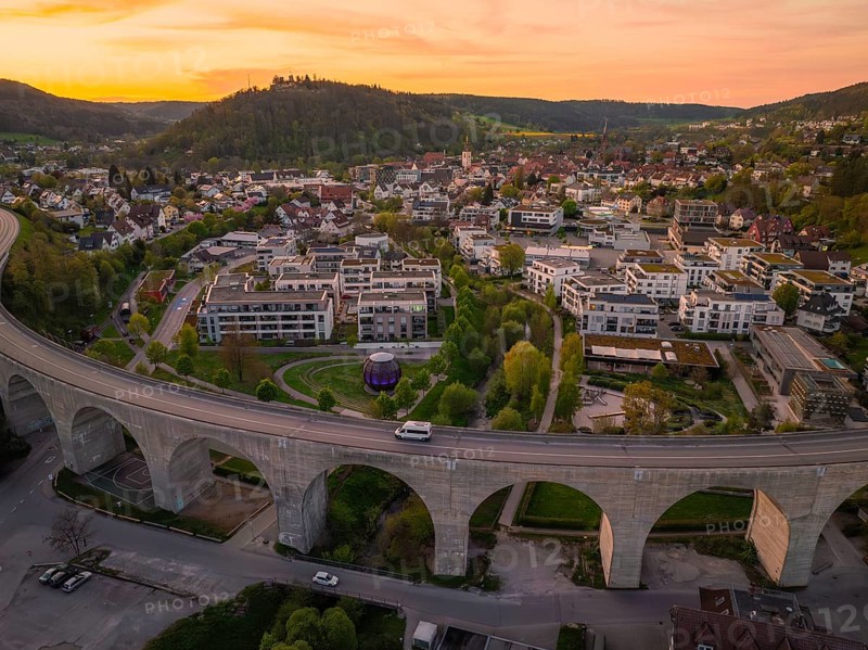 Panoramic view of a town with viaduct and buildings in the evening, Nagold, district of Calw, Germany
