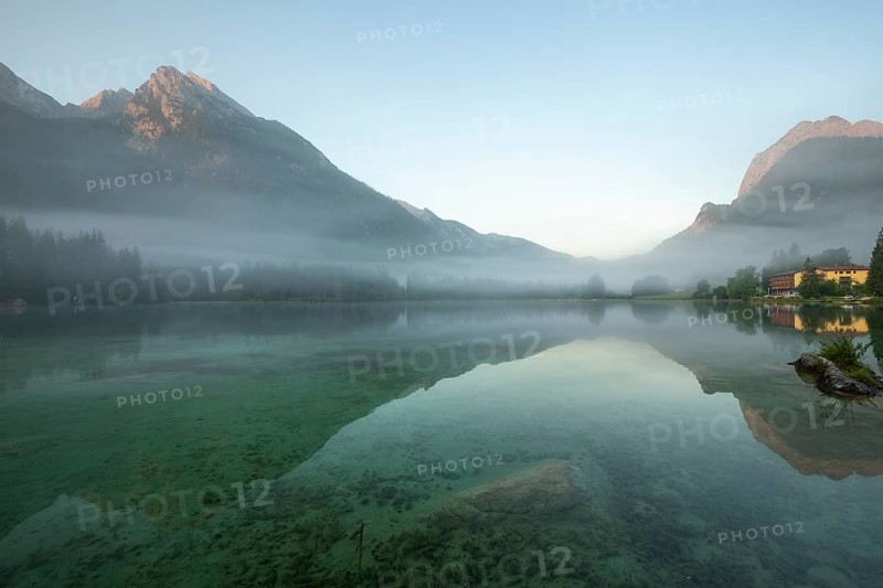 Magical sunrise with fog at Hintersee near Ramsau in Berchtesgadener Land