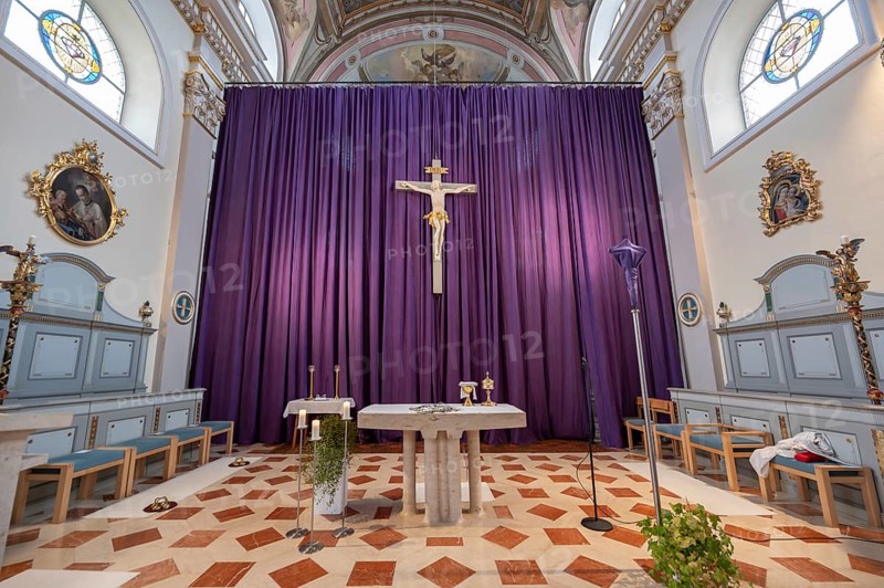 Large purple Lenten cloth in front of the high altar in the baroque parish church of St Nicholas, built between 1722 and 1724, Kirchacker 20, Tannheim, Austria
