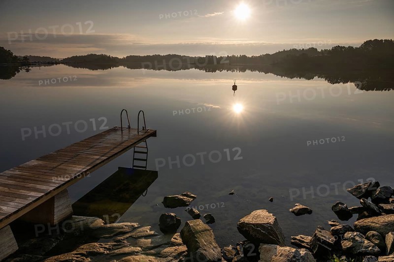Wooden jetty with ladder, calm water surface, morning atmosphere, Kasnäsintie, Falkö Fjord, Kasnäs, Hitis archipelago, archipelago south of Turku, Finland