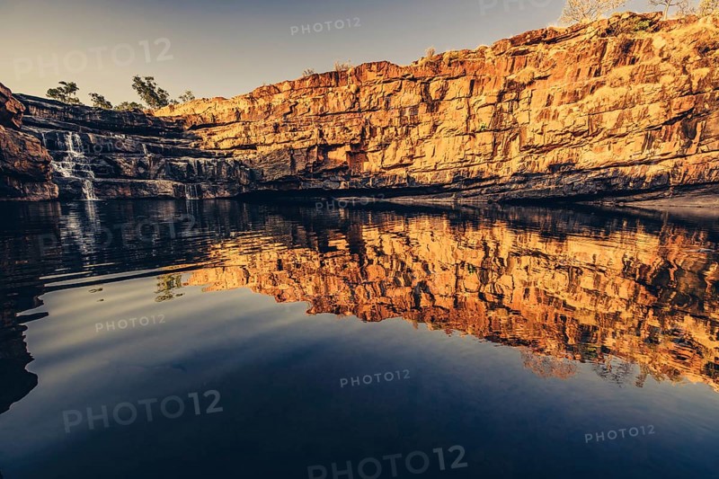 Bell Gorge waterfall, a body of water in north-west Australia in the Kimberley. Sunrise in the outback, Australia