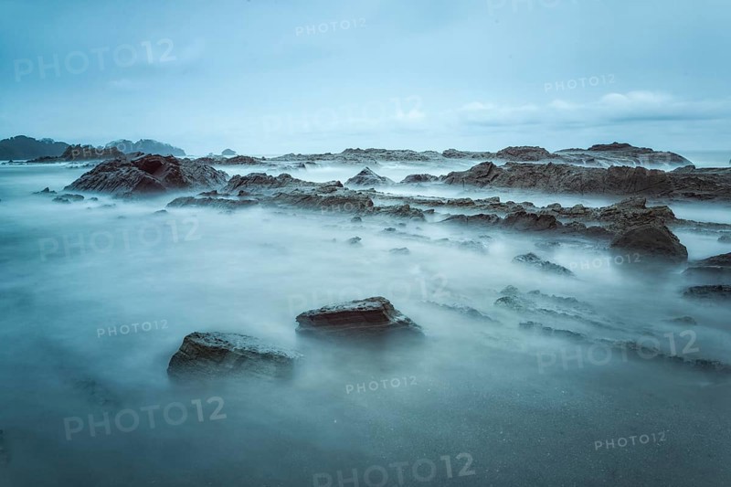 Cloudy weather meant a break from my ultralight photography on the Pacific Coast. I headed to my favorite beach near Dominical on Costa Rica's Pacific Coast hoping the sun would break through at the end of the day. It never did but the heavy overcast coupled with a 2 minute exposure (via the use of a 10 stop neutral density filter) made for an evocative image nonetheless
