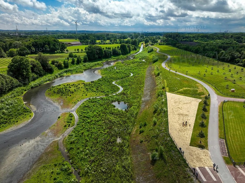 Recklinghausen, Castrop-Rauxel, Ruhr area, North Rhine-Westphalia, Germany - Renaturalised Emscher, EMSCHERLAND adventure park, a new nature and water adventure park on the renaturalised Emscher, at the water crossing of the Emscher with the Rhine-Herne Canal on the city boundary of Recklinghausen and Castrop-Rauxel. In front is the Emscherstrand, a 1000 square metre sandy beach by the river. Flood protection by expanding the area. The ecological focus at the confluence of Suderwicher Bach and Emscher will also be a future garden for the International Garden Exhibition IGA 2027. Before the renaturalisation, the Emscher river system was an open, above-ground wastewater channel, combined sewer with surface water and wastewater