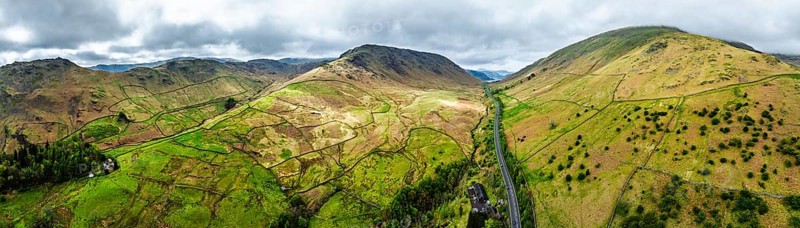 Panorama of Mountains over road A591 from a drone, Grasmere Lake, Grasmere, Ambleside, Lake District, Westmorland, Cumbria, UK