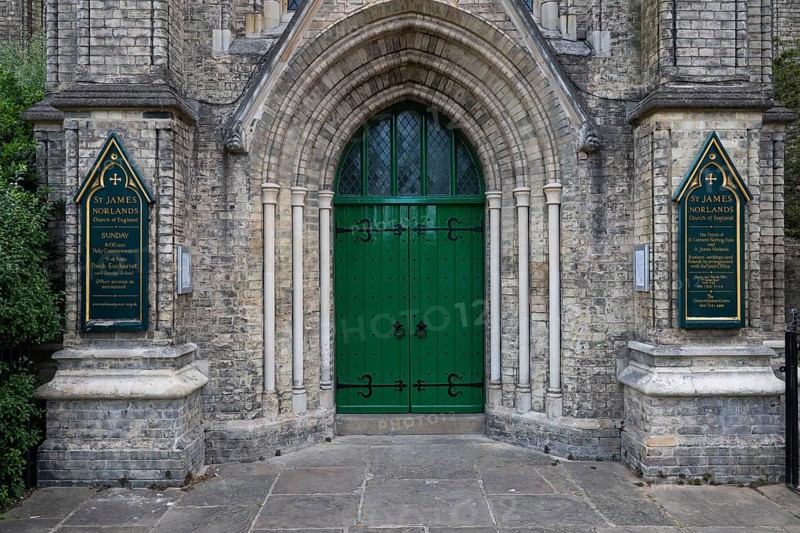 Neo-Gothic church entrance with green door, St James's Church, Norlands, architects Lewis Vulliamy, Robert Jewell Withers, Kensington, London, England, Great Britain