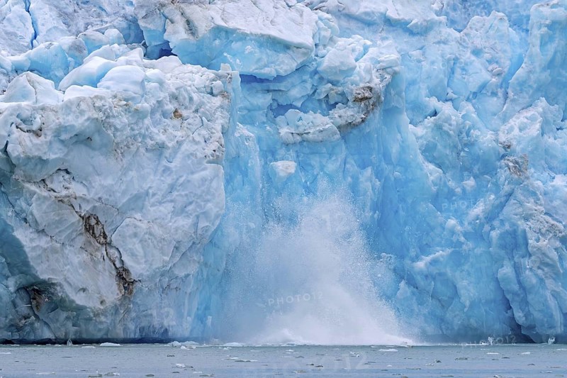 Collapsing ice wall of Fjortende Julibreen, 14th of July Glacier calving into Krossfjorden, Haakon VII Land, Spitsbergen, Svalbard, Norway